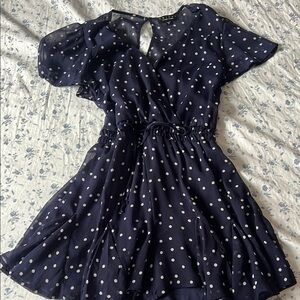 Francesca’s Navy Polka Dot Romper